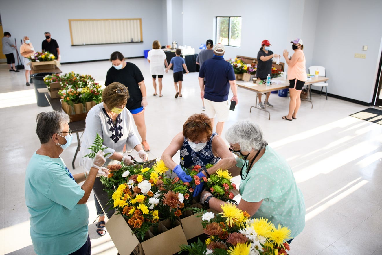 ‘For the community’: Dunn volunteers deliver flowers to nursing homes during pandemic