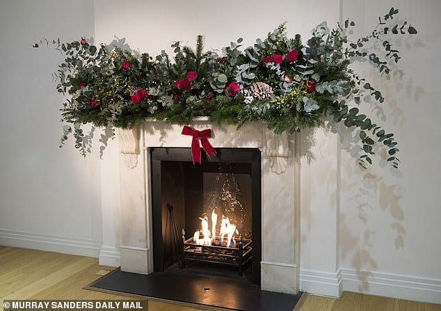 Add some magic to your mantelpiece: With this ingenious trick using just one tree and a couple of bouquets of supermarket roses