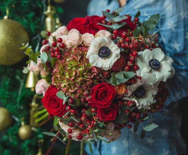 woman-holding-bouquet-autumn-colour-flowers-hand