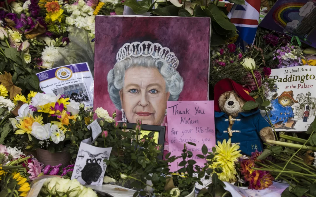 A London park blooms with flowers, stuffed animals and handwritten notes to the queen