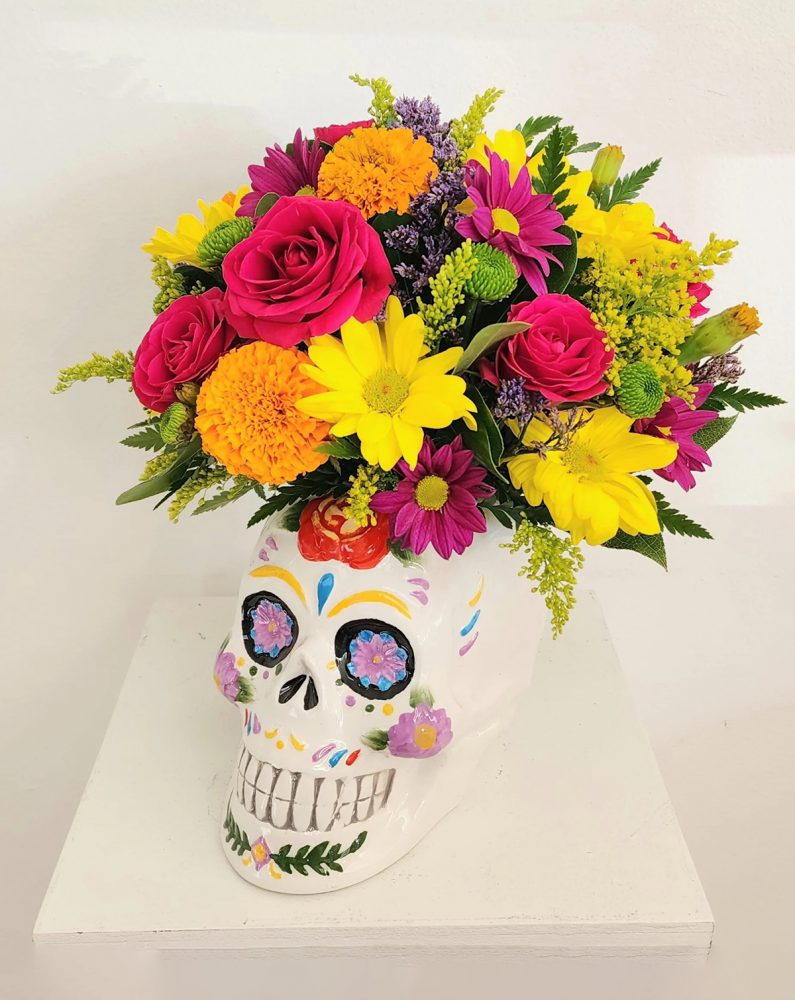 flowers in a skull vase/ dia de los muertos