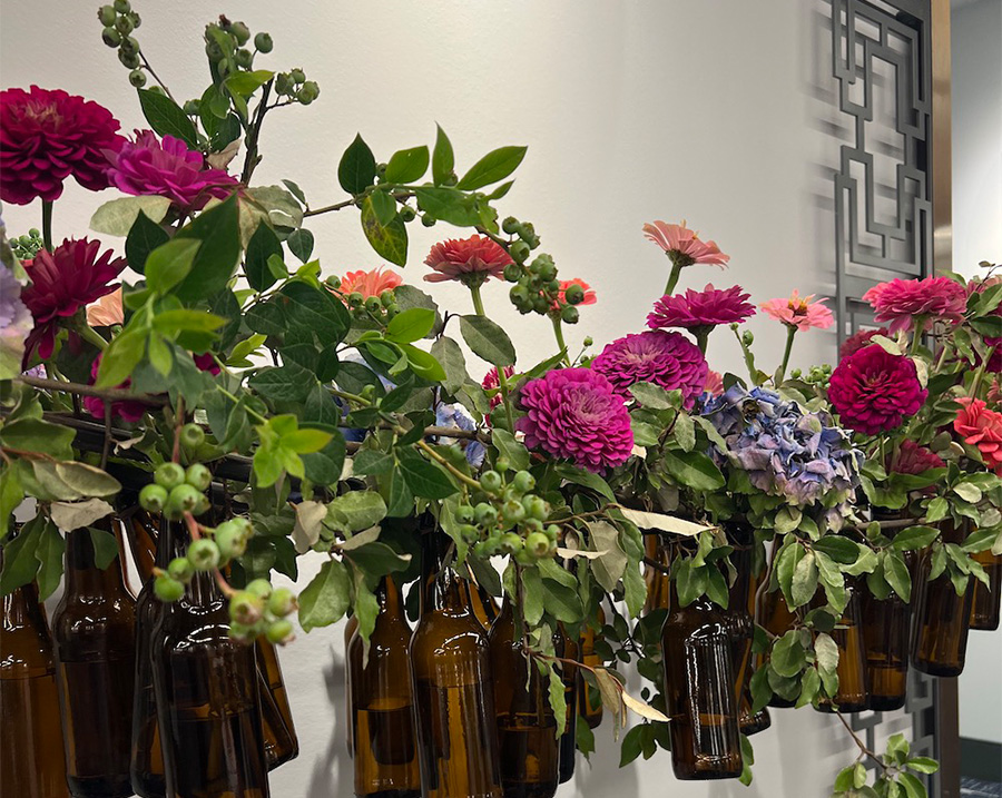 bottles strung together with flowers