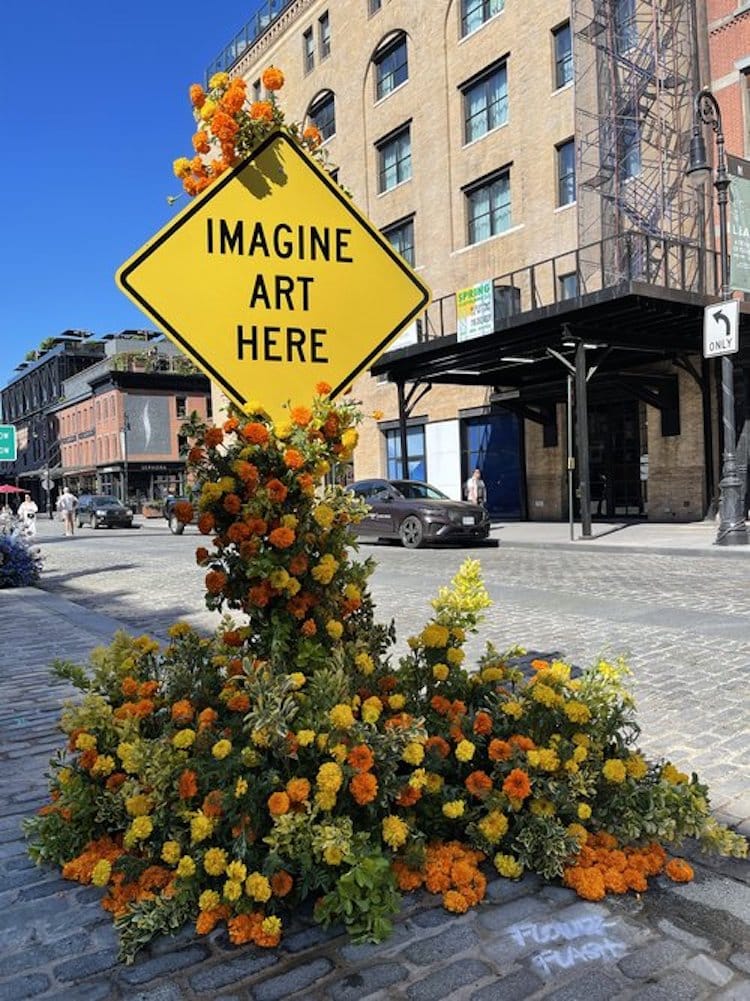 street sign with flowers