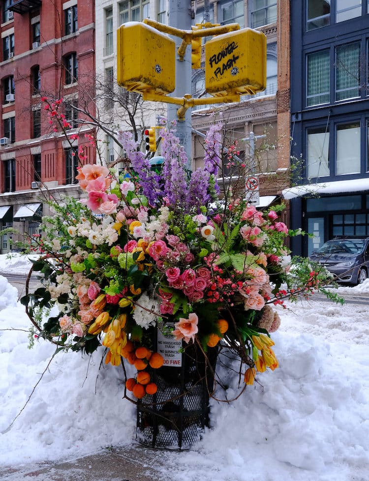 garbage can with flowers in winter