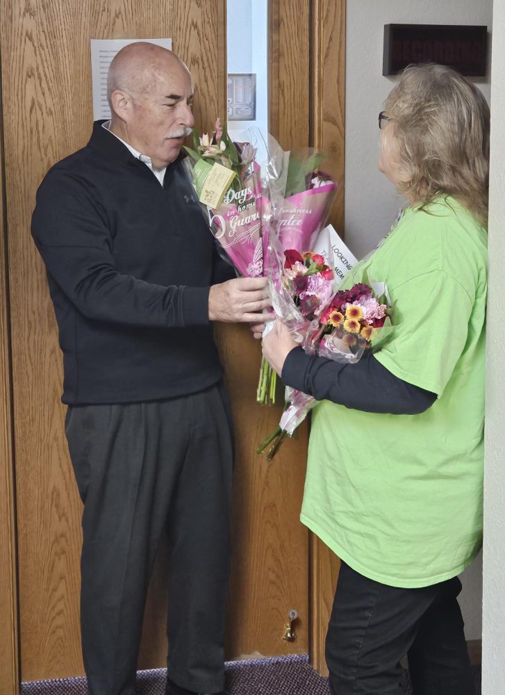 gifting flowers to an older man