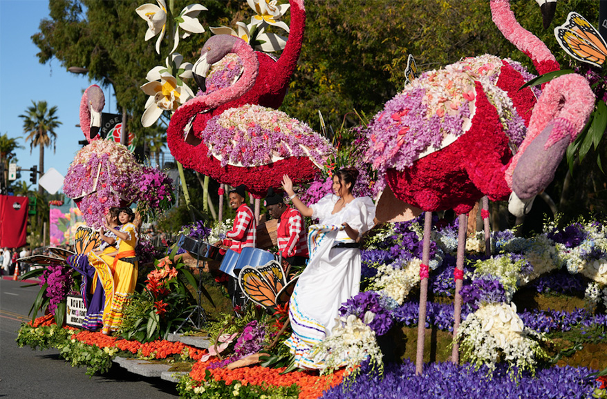 float with flamingos made form flowers and natural elements